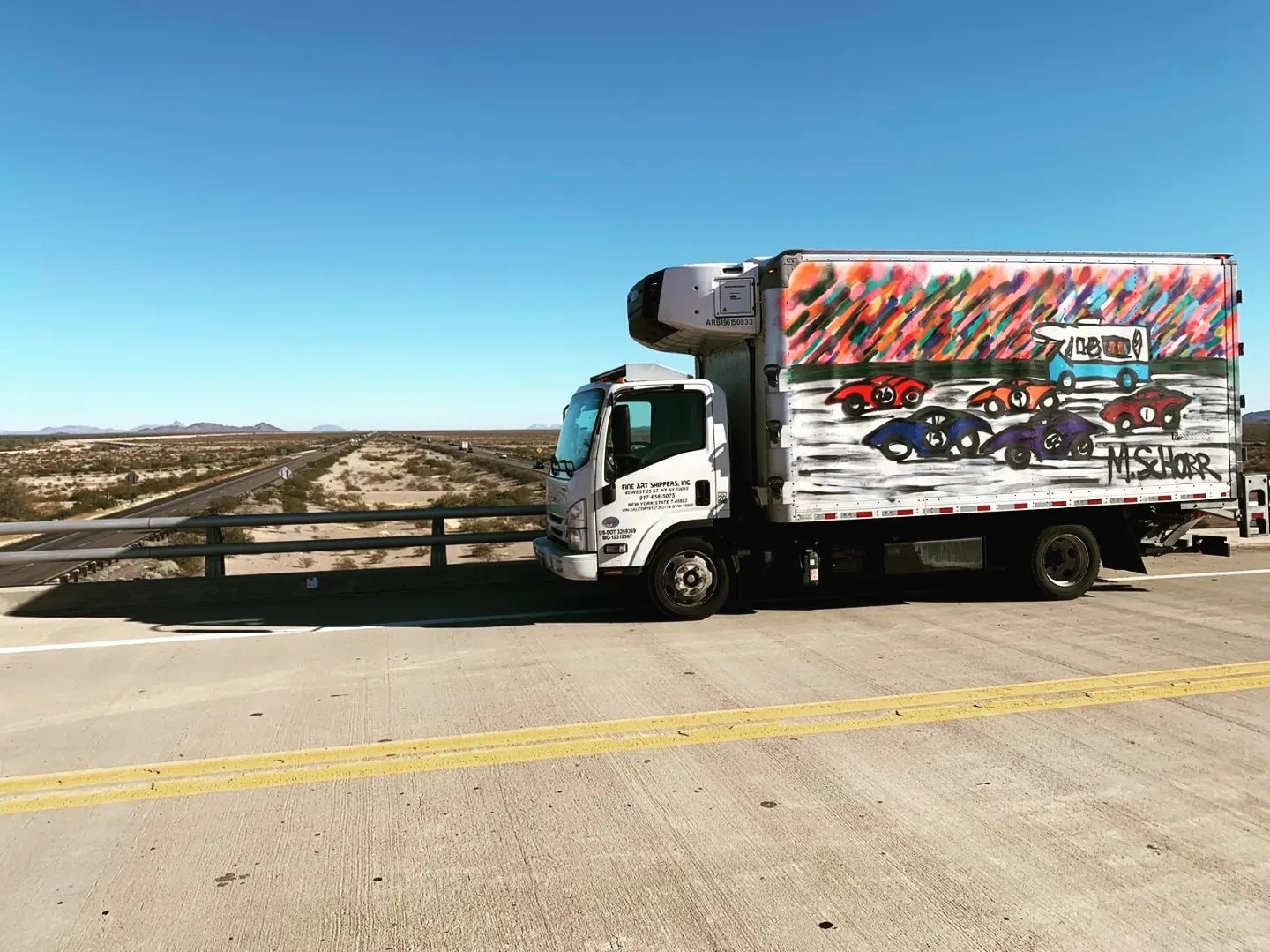 Da Race Moving - art truck on snowy mountain road